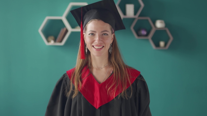 A student girl shows off her diploma. Distance learning.  Royalty-Free Stock Footage #1053872093