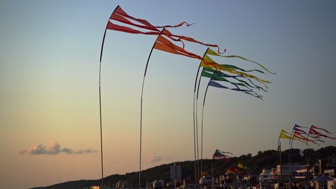 Beach promenade with waving flags in Helsingborg, Skane, southern Sweden