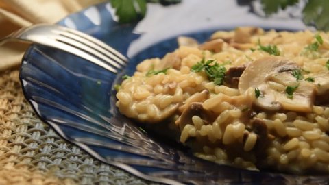 Plate of risotto with mushrooms and  parsley