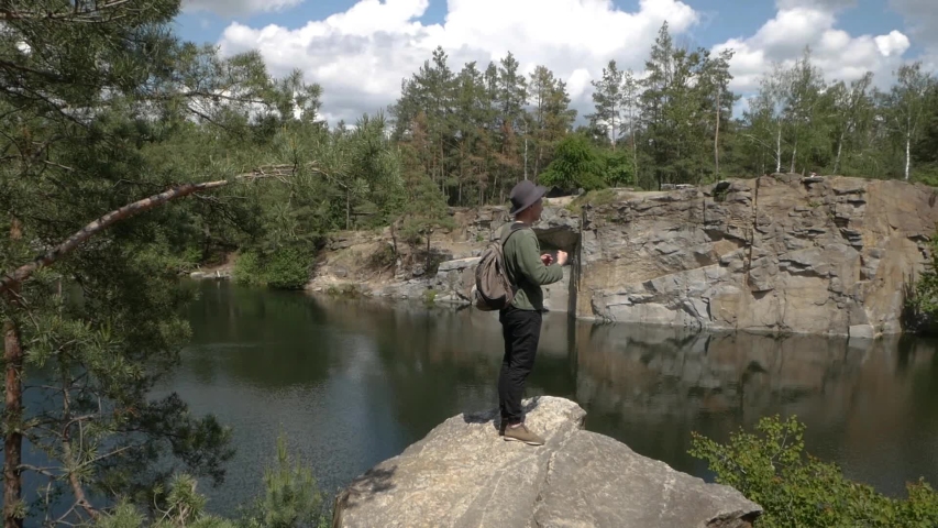Traveller Enjoying The Scenic Beautiful View Of Rock