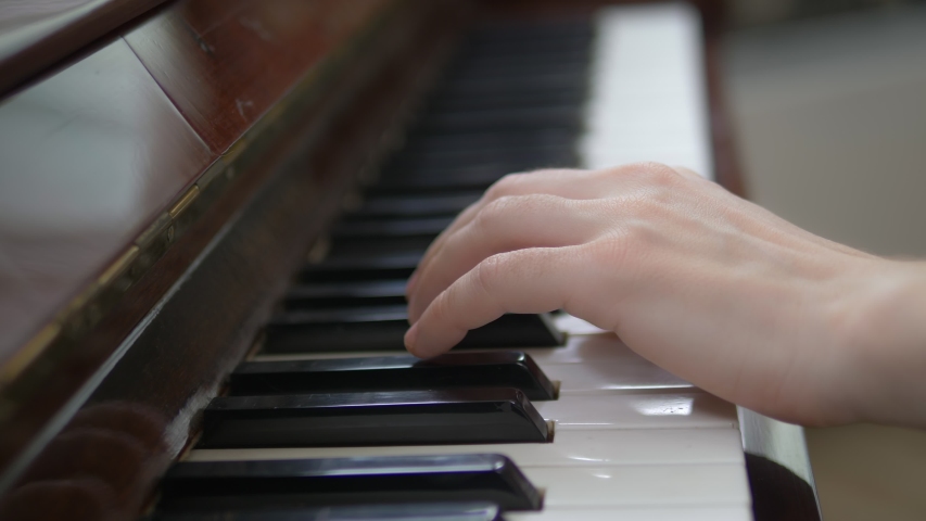 closeup. female hands masterfully play the arpeggio on the piano. Royalty-Free Stock Footage #1053885710