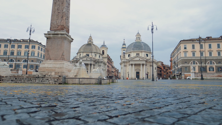 Low shot walking at empty Piazza del Popolo, on a cloudy day in Rome - Coronavirus Pandemic | Shutterstock HD Video #1053893369