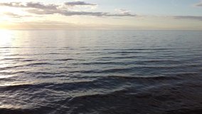 water surface of the Gulf of Finland at sunset aerial video