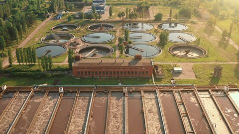 Aerial view of wastewater treatment plant at sunset, filtration of dirty or sewage water