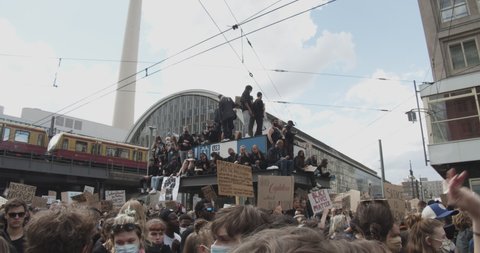 Crowd of Protestors holding up signs against Police Brutality Black Lives Matter Deomonstration in Berlin, Germany June 6th 2020