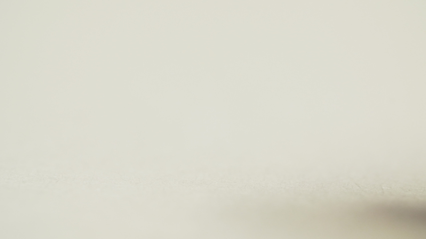 Pen draws a dot a white background paper, macro shot | Shutterstock HD Video #1053921026
