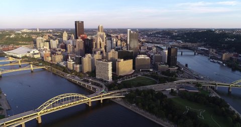 PITTSBURGH, PENNSYLVANIA - SEPTEMBER 20, 2019: Pittsburgh Cityscape, Pennsylvania. City is Famous because of the bridges. Sunset Light. Business Skyscrapers in Background