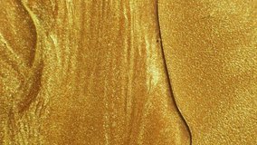 Glitter fluid motion. Molten gold. Sparkling yellow liquid paint flow overlay. - Powered by Shutterstock - Get 15% off with code: PIKWIZARD15