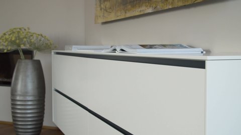 Modern White Chest of Drawers as a Furniture in a Living Room 