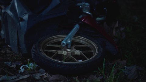 close up shot of motorcycle wheel on ground after an accident crash