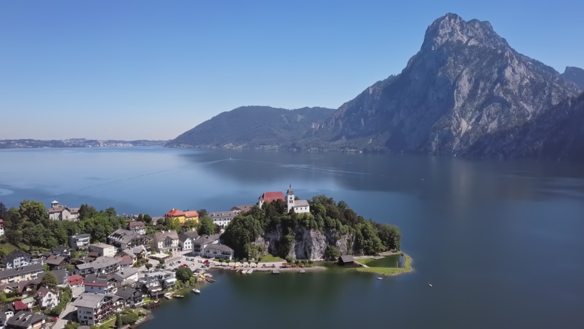 Flight around of Traunkirchen church on Traunsee lake, in Salzkammergut, Upper Austria.