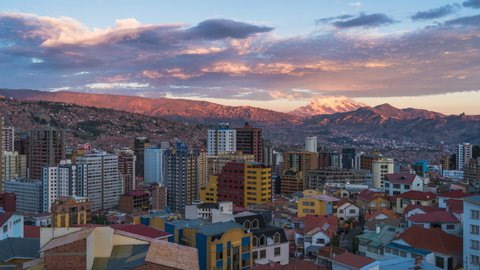 La Paz, Bolivia, day to night timelapse view of cityscape and Illimani mountain.