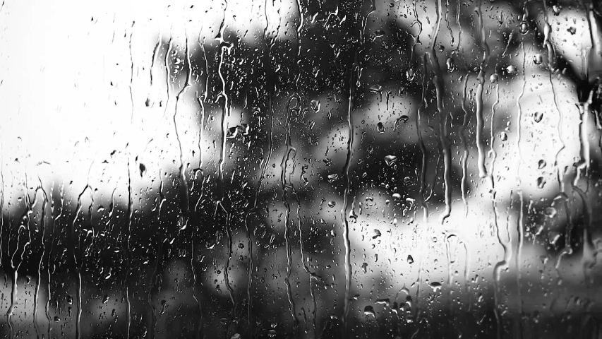 Close up view of water drops falling on glass. Rain running down on window. Rainy season, autumn. Raindrops trickle down, grey sky. Great for special effects and motion graphics Royalty-Free Stock Footage #1053943892