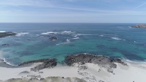 Drone truck dolly shot drone of coastline of Isle of Barra, Scotland. Outer Hebrides. Scotland. Epic aerial drone video of the coastline