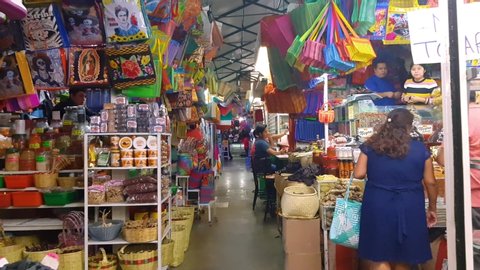 Oaxaca, Mexico - August 21, 2018: Traveling in a traditional Mexican market in the center of Oaxaca. where vegetables, fruits, spices, mole, food, sweets, chocolate, toys, piñatas, crafts are sold.