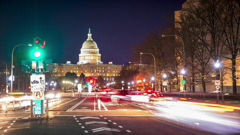 Time-lapse of evening rush hour traffic racing around the United States Capitol Building in Washington, DC.