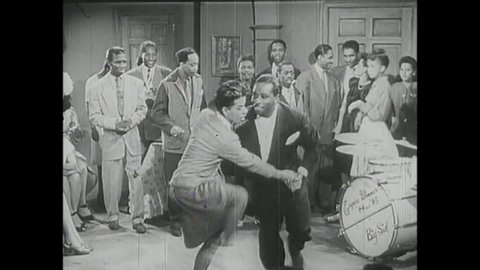 CIRCA 1947 - In this classic race film musical, African-American couples dance to swing music.