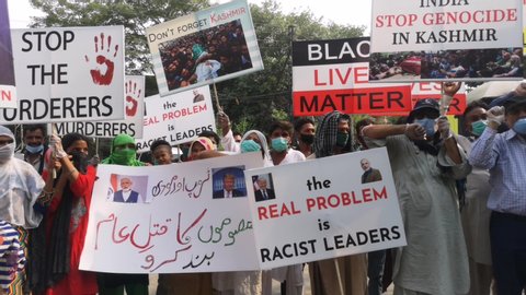 Pakistani activists rally to condemn human rights discrimination and the death of George Floyd, a black man in Minneapolis, in Lahore, Pakistan, Monday, June 8, 2020.
