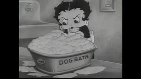 CIRCA 1935 - In this animated film, Betty Boop's puppy Pudgy escapes his bath and she must chase him on a sliding bar of soap around the house.