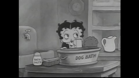 CIRCA 1935 - In this animated film, Betty Boop sings as she prepares a bath for her puppy Pudgy, who is playing with a bone in the next room.