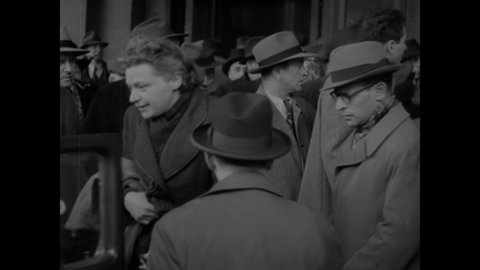 CIRCA 1944 - Families of Jewish refugees arrive in Canada by train, and are escorted into cars.