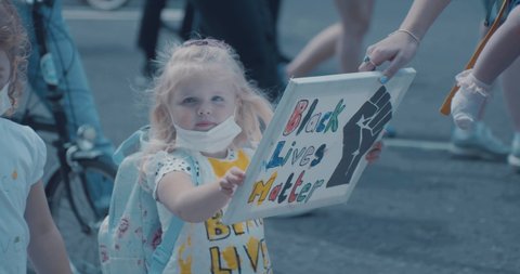 Bristol, UK - June 07 2020: Young child holding Black Lives Matter sign at march