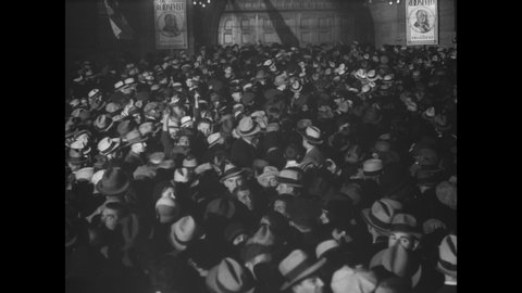 CIRCA 1932 - Huge crowds are gathered in the Holland Tunnel of Newark, New Jersey to hear former Governor Al Smith give a speech campaigning for FDR.