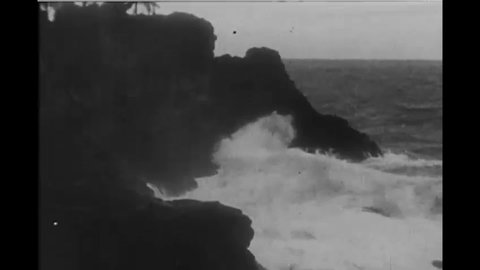 CIRCA 1927 - Jesus likens his disciples to those who build their houses upon rocks. To illustrate this, ocean waves beat against immovable rocks.