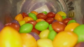 Pan Over Round Candy Sweets on a wooden table. View goes right into the glass jar. - Powered by Shutterstock - Get 15% off with code: PIKWIZARD15