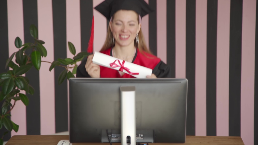 College graduate. Online education, web-based educational videos, online courses and trainings, e-learning concept. Royalty-Free Stock Footage #1053973367