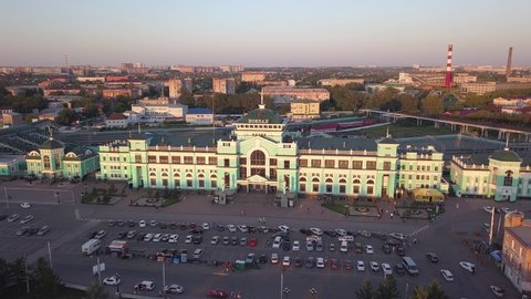D-Cinelike. Russia, Omsk - July 16, 2018: The central railway station of the city of Omsk. The building of the station. Sunset, Aerial View
