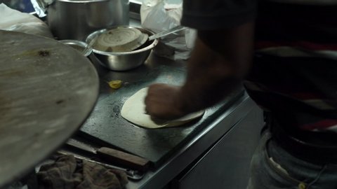 Making Indian bread dough at street food restaurant. 