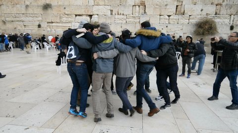 JERUSALEM, ISRAEL - 25th DECEMBER 2016: Jews dancing in front of Western wall in the old city of the Jerusalem, Israel.