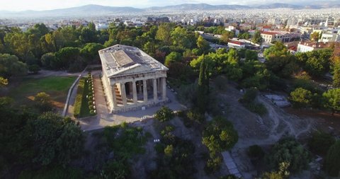 Aerial panorama view of ancient Roman Forum temple at sunset. Green trees line pathways with no people. 3 clips included (forward and backward motion, circular tracking in true C4k lossless Prores.