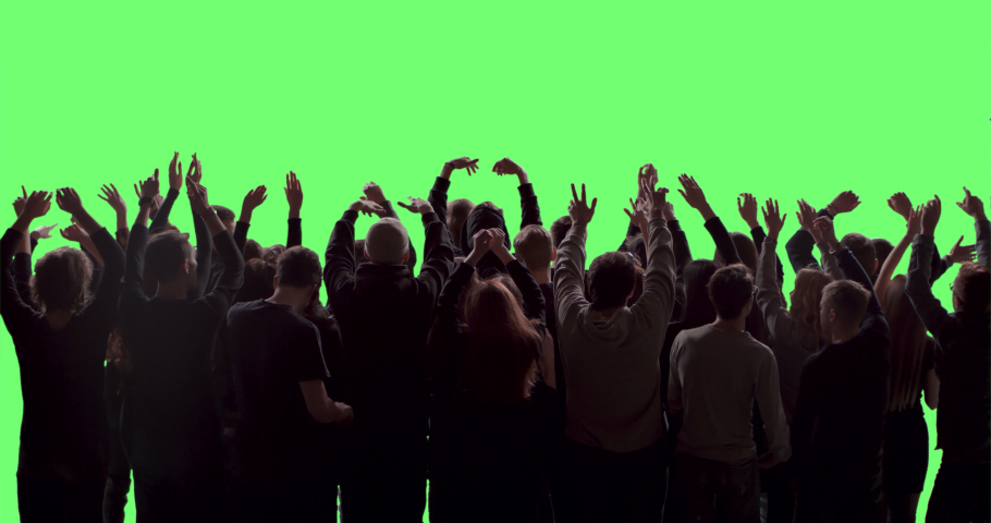 GREEN SCREEN CHROMA KEY Model released, back view of a crowd dancing and cheering at a concert or a show. Shot on RED Helium 8K in RAW