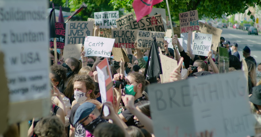 Warsaw, Poland - June 6, 2020: Black Lives Matter Protest in Europe after George Floyd death in USA. Solidarity Demonstration with Signes against Police Brutality and Injustice.