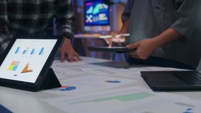 Millennial Asia businessmen and businesswomen meeting brainstorming ideas about new paperwork project colleagues working together planning success strategy enjoy teamwork in small modern night office. - Powered by Shutterstock - Get 15% off with code: PIKWIZARD15