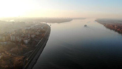 Aerial view of Danube river at sunset, Belgrade, Serbia. Mist and haze in the air.