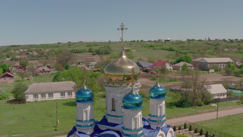 Christian church in the Ukrainian village - Aerial View on an summer day. Ukraine.  | Shutterstock HD Video #1054038389