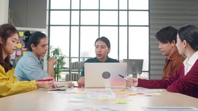 Multiracial group of young creative people in smart casual wear discussing business brainstorming meeting ideas mobile application software design project in modern office. Coworker teamwork concept. - Powered by Shutterstock - Get 15% off with code: PIKWIZARD15