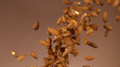 Super slow motion of flying almond nuts collision. Filmed on high speed cinema camera, 1000 fps.