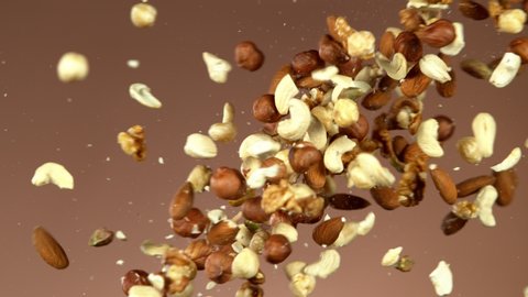 Super slow motion of flying mix nuts collision. Filmed on high speed cinema camera, 1000 fps.