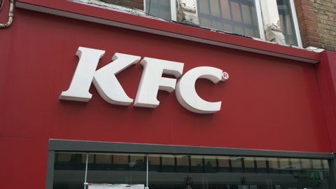 London. UK- 06.06.2020: The shop sign above a branch of KFC in red and white and the company's trademark and logo.