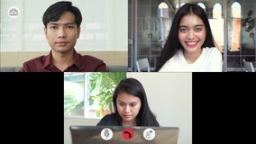 Video call screen shot the faces of Asian colleagues or partners meeting remotely with video conferences, greetings and meetings together while working from home and keep social distancing in 4K Res.