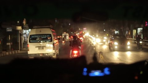 Kathmandu, Nepal - 14 November 2019: View from a car stuck in traffic jam at night at a nepalese busy road. Night time. Asian streets. Kathmandu, Nepal.