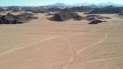 Day top view of the Sahara desert, desert mountains. Sands. 