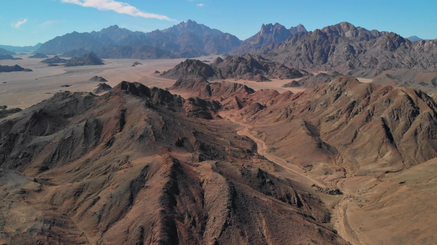 Day top view of the Sahara desert, desert mountains. Sands. 