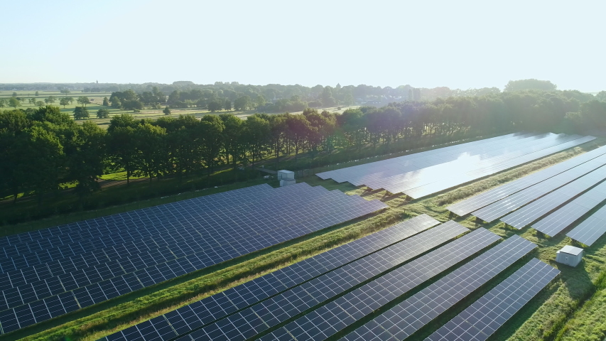 Vast area of farmland now covered with solar power, power generation. | Shutterstock HD Video #1054078376