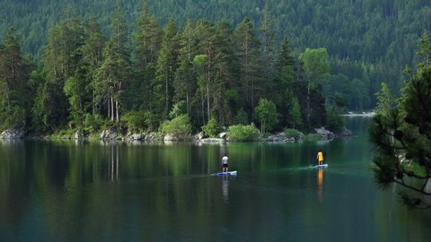 WS People paddleboarding on Lake Eibsee near Grainau / Upper Bavaria, Germany,Nature