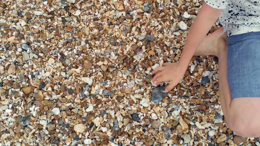 AERIAL ZO MS Boy playing on beach / Portsmouth Beach, England,People